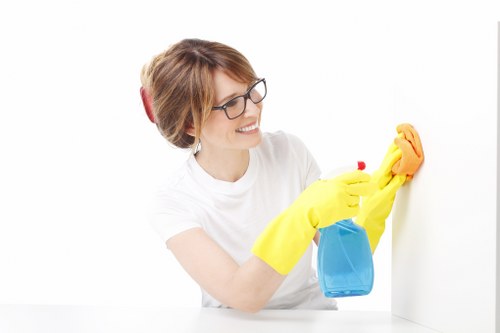 Team member placing warning sign near a freshly cleaned floor